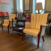 Pair Of Cream Vinyl Mahogany Wingback Armchairs
